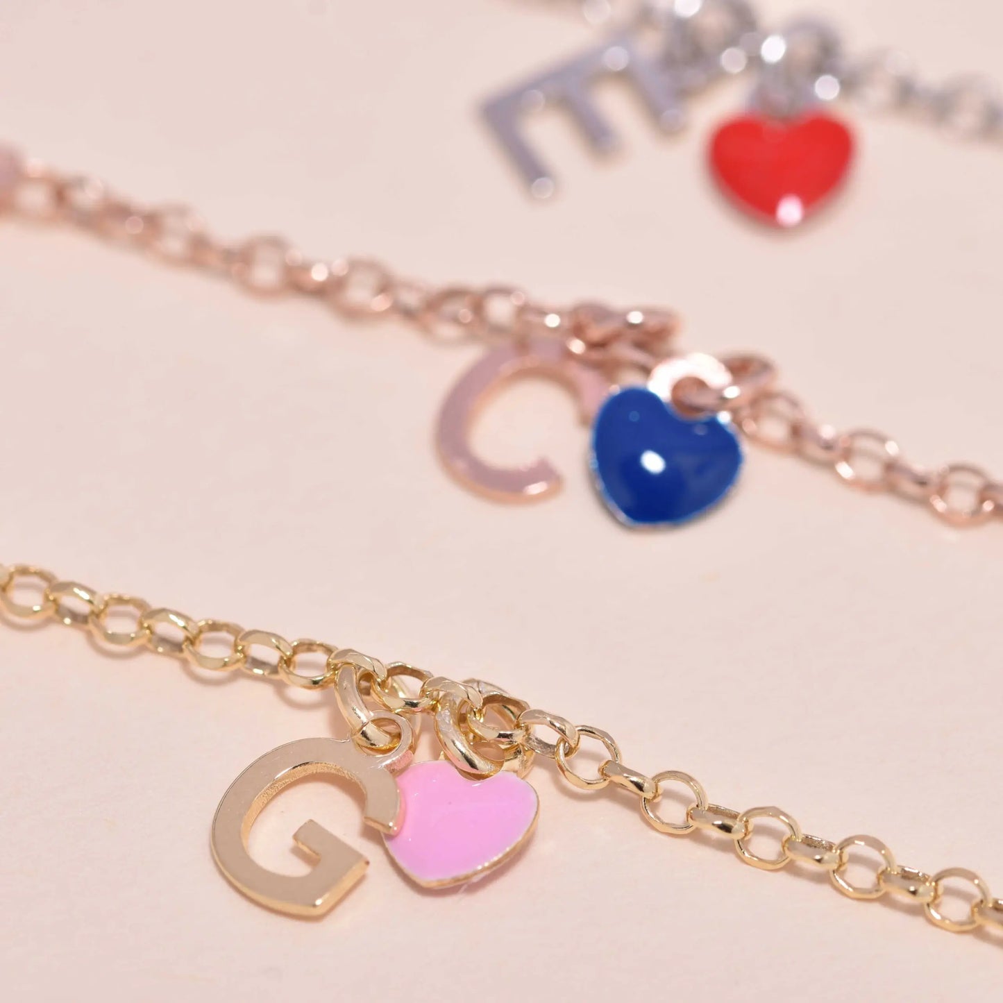 Bracciale argento giallo con cuore rosa