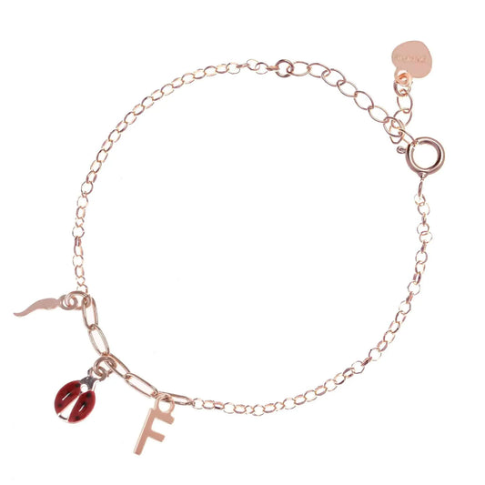 Bracciale regolabile in argento 925 rose’ con coccinella smaltata rossa, cornetto lucido e letterina pendente.