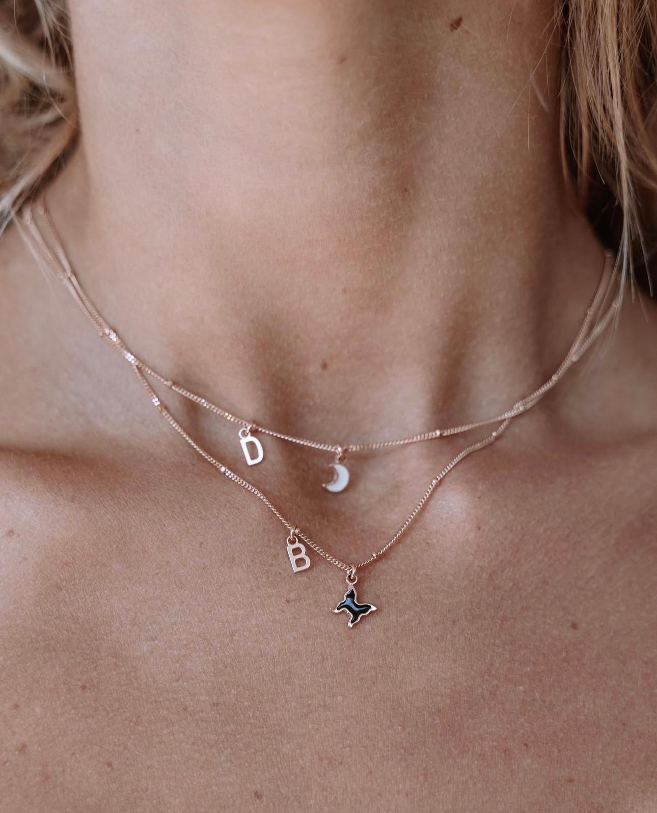 Megghy necklace with white heart and letter